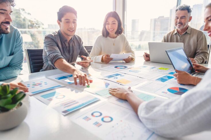 Group of people working with paperwork